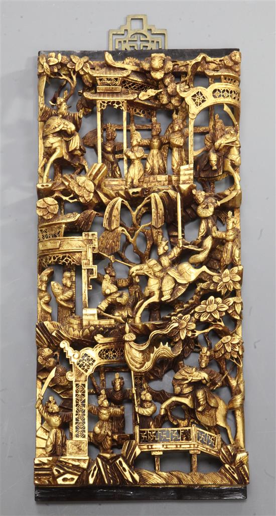 A Chinese carved giltwood panel depicting Courtesans and Warriors, H.54cm x W.24.5cm